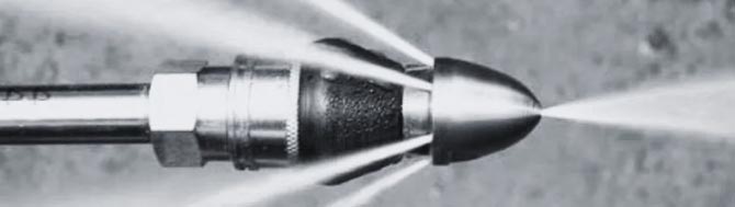 High pressure water jetting for drain lines